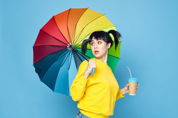 cheerful woman with rainbow colored umbrella posing street style - Fotografie, Obrázek
