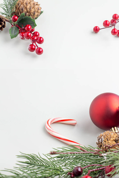 Christmass tree and mint cane with red ball on white background - Foto, afbeelding