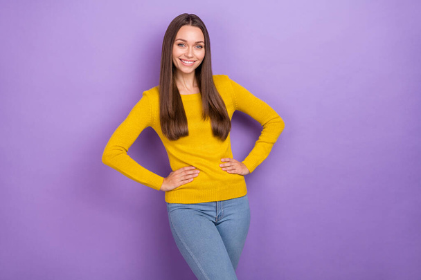 Photo of young cheerful lovely woman arms on waist confident wear casual outfit isolated over violet color background - Fotó, kép