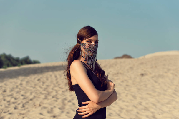Young brunette on the hot sand - Fotografie, Obrázek