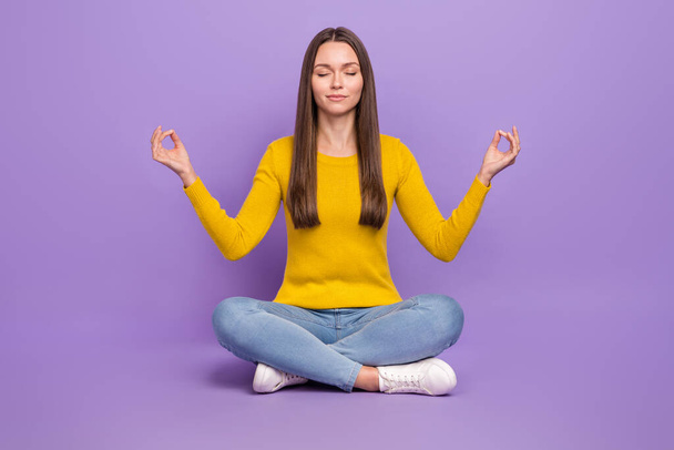 Full body photo of young girl sit floor dream meditate peaceful relax isolated over violet color background - Фото, зображення