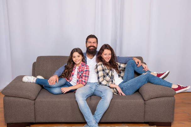 happy family portrait sitting on sofa at home, family - 写真・画像