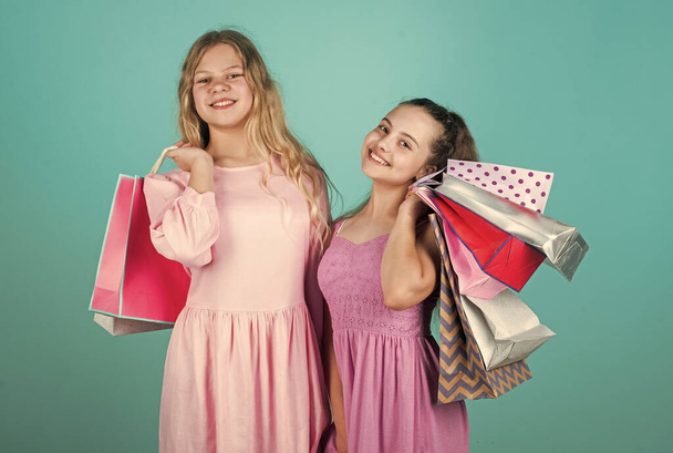 kids go shopping. gifts and presents. buy purchase in shop. shopper children. happy childhood - Foto, Imagen