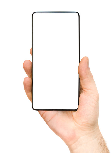 隔離された白い背景の男性の手の現代的なスマートフォン - 写真・画像