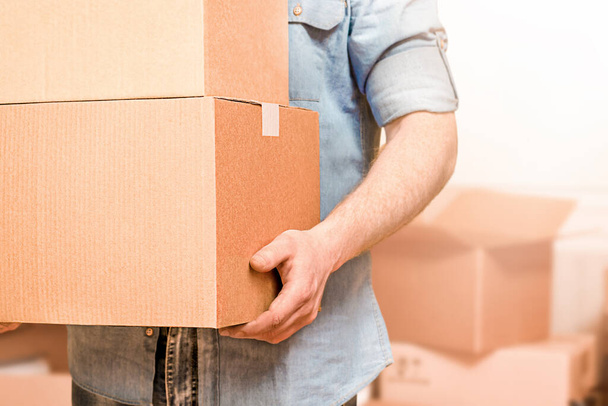 man carries boxes in his hands, moving concept - Photo, Image
