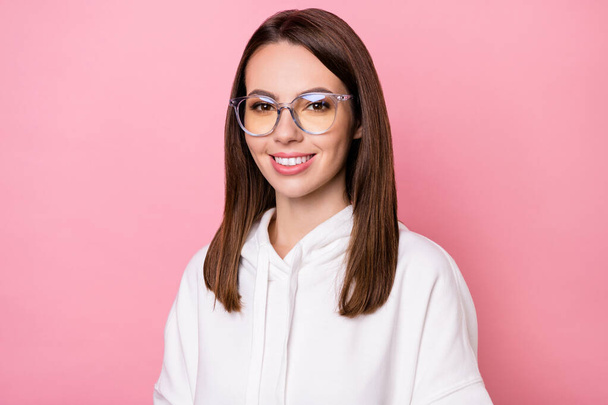 Photo of adorable happy young woman wear glasses hoodie casual clothes isolated on pink color background - Fotó, kép