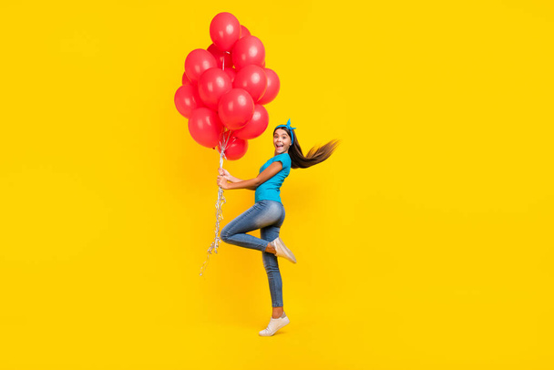 Full body profile side photo of youth teen lady many balls decor event present isolated over yellow color background - Fotografie, Obrázek