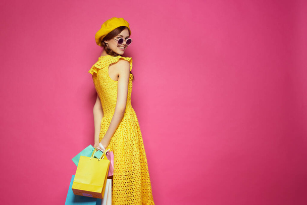 smiling woman wearing sunglasses posing shopping fashion studio model - Fotoğraf, Görsel