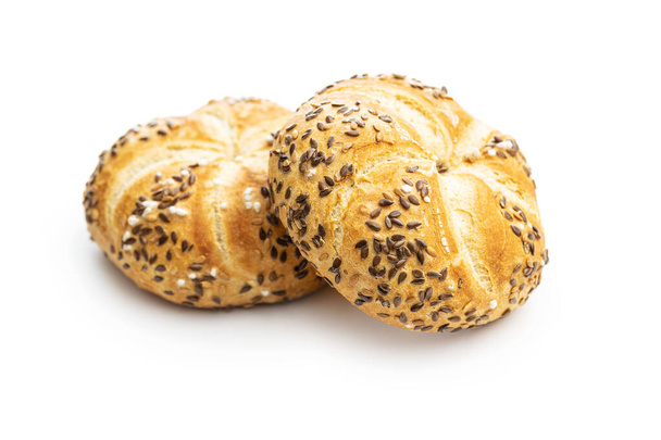 Four baked french buns with seeds isolated on white background. - Foto, Imagem
