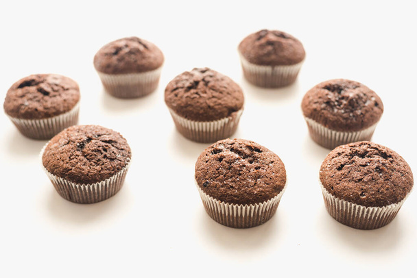 Chocolate muffins on a white plate. Confectionery. - Fotoğraf, Görsel