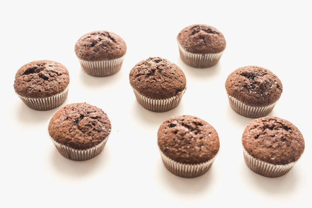 Chocolate muffins on a white plate. Confectionery. - Foto, Imagem