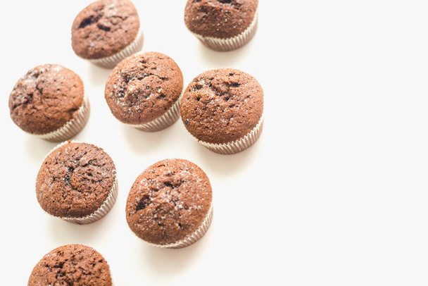 Chocolate muffins on a white plate. Confectionery. - Valokuva, kuva