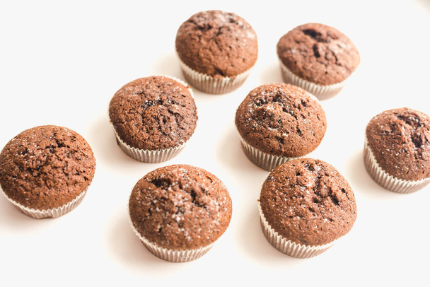 Chocolate muffins on a white plate. Confectionery. - Zdjęcie, obraz