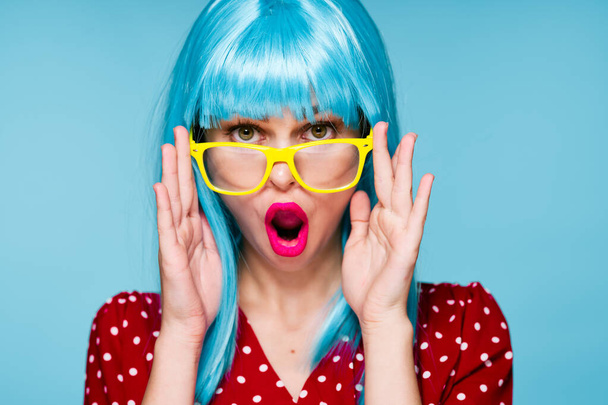 glamorous woman in blue wig yellow glasses posing model - Photo, image