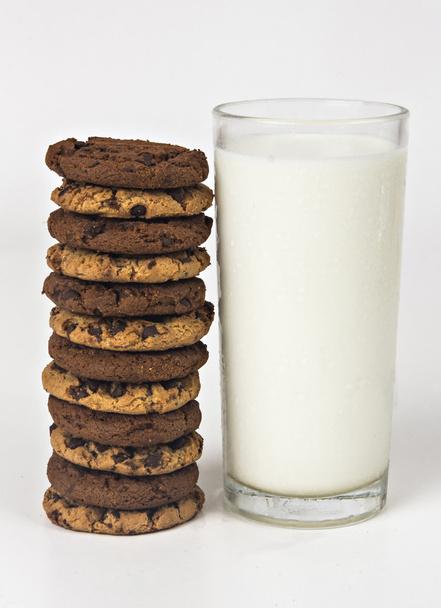 Milk glass  and cookies on white background - Valokuva, kuva