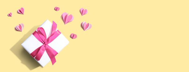 Gift box with pink paper hearts - Photo, image
