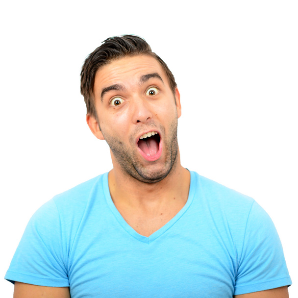 Portrait of man with funny face against white background - Photo, Image