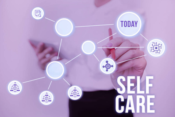 Text sign showing Self Care. Concept meaning practice of taking action preserve or improve ones own health Lady In Uniform Standing Holding Tablet Typing Futuristic Technologies. - Photo, Image
