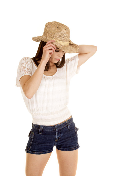 brunette cowgirl hand on hat look down - Valokuva, kuva