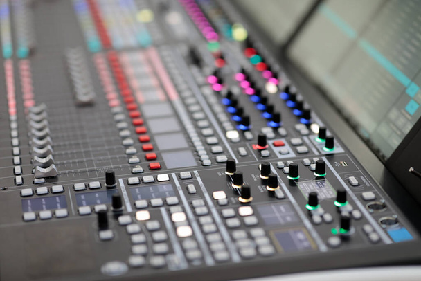 Digital mixing console in a broadcasting studio. Selective focus. - Photo, Image