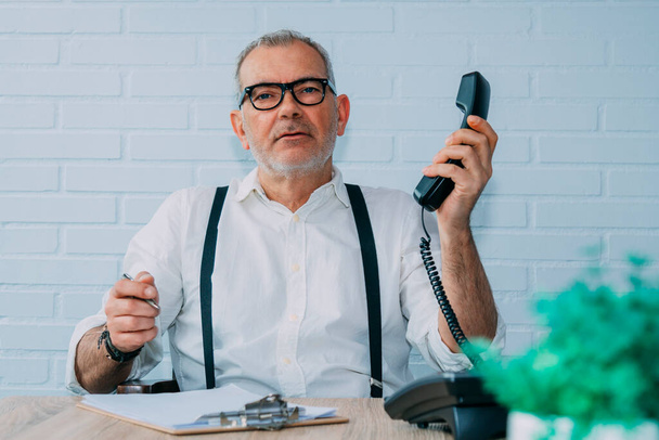 hipster man with landline phone working at home or office - Fotoğraf, Görsel