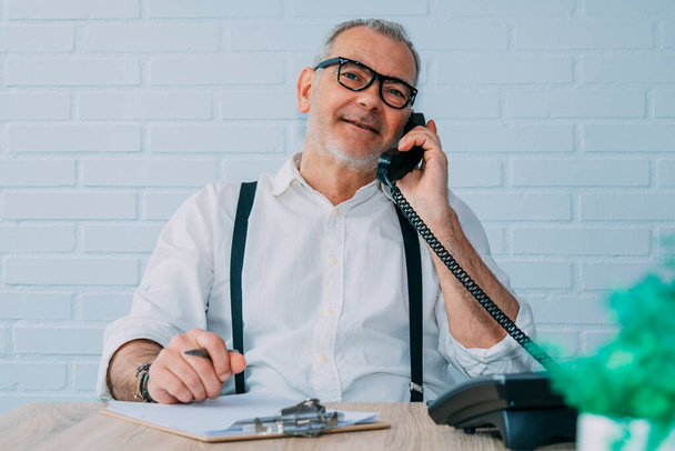 hipster man with landline phone working at home or office - Фото, зображення