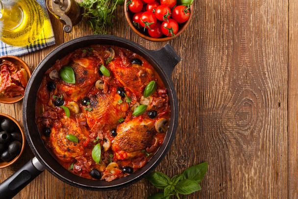 Traditionally made chicken in tomato sauce cacciatore. Top view. Flat lay. - Foto, imagen