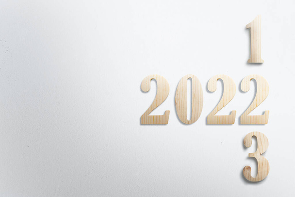 2022 with white wall background. Happy New Year 2022 - Fotografie, Obrázek