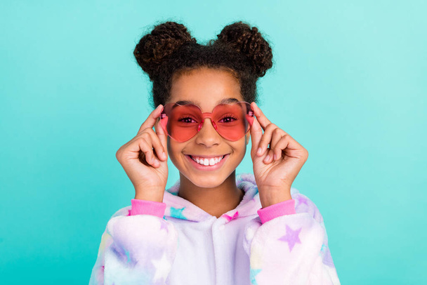 Photo of cheerful afro american trendy stylish girl wear sunglass pajama isolated on teal color background - Fotoğraf, Görsel