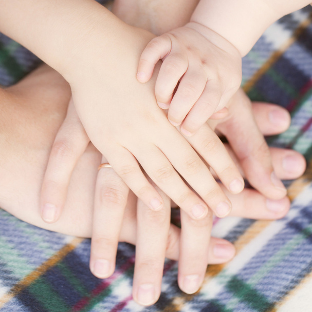 Four hands of the family together. - Photo, Image