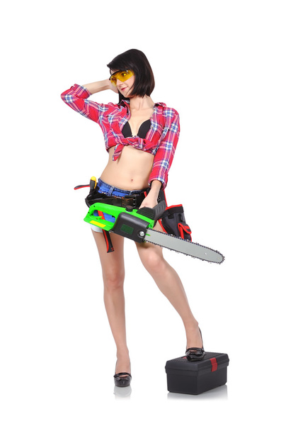 beautiful girl holding chainsaw - Foto, afbeelding