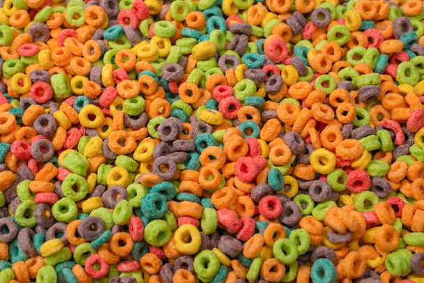 Sweet multicolored flakes, cereal loops as a background..  - 写真・画像