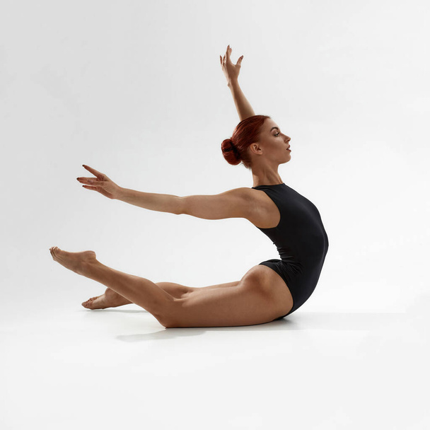 Beautiful woman dancing ballet on white background - Valokuva, kuva