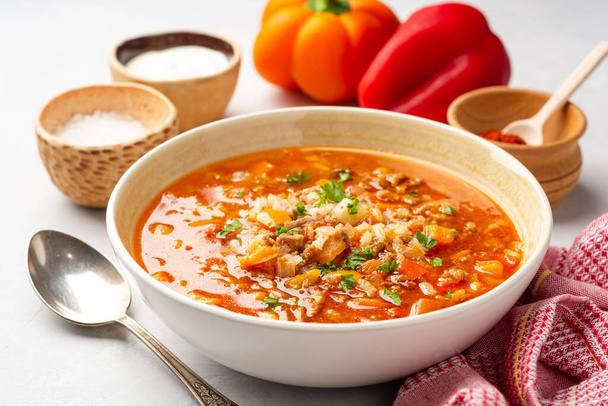 Stuffed pepper soup in bowl on concrete background. Selected focus. - Foto, Bild