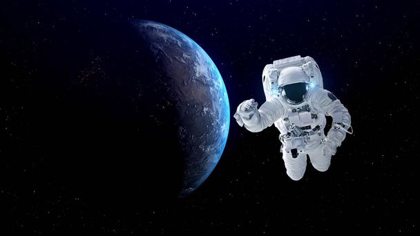 宇宙飛行士は宇宙飛行士の仕事をしながら宇宙遊泳を行います - 写真・画像