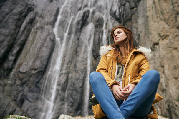 woman yellow jacket tourism mountains adventure landscape - Фото, изображение