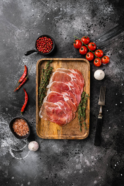 Cold cured Italian meat set, on black dark stone table background, top view flat lay, with copy space for text - Fotó, kép
