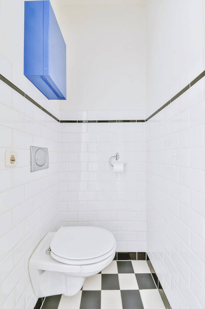 Small restroom with checkerboard floor - Photo, Image