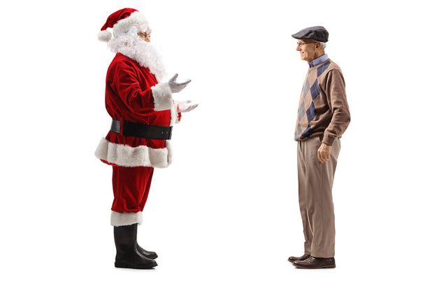 Santa Claus standing and talking to an elderly man isolated on white background - Fotografie, Obrázek