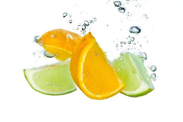 Citrus fruit splashing - Fotoğraf, Görsel