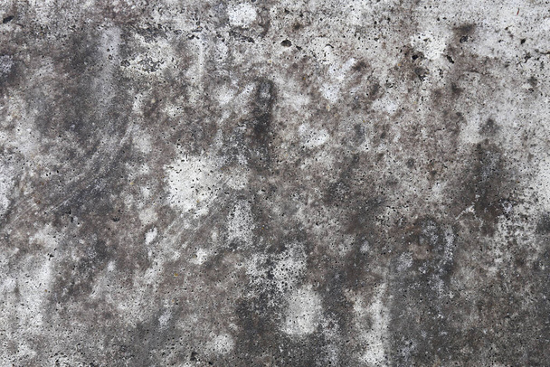 A closeup on the grey textured swirls of a weathered stone concrete slab. - Photo, Image