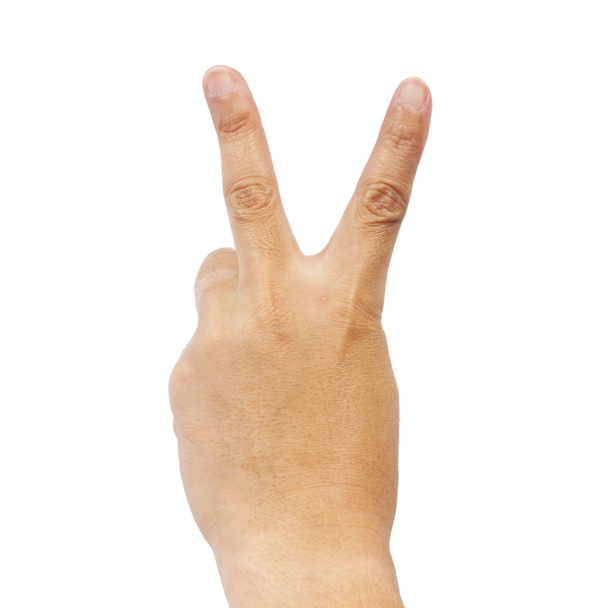 Hand showing the v sign on white background - Valokuva, kuva