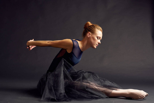 woman dancer in a black dress dance fashion exercise studio lifestyle - Фото, изображение