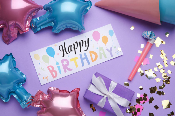 Text HAPPY BIRTHDAY and party set on purple background - Photo, Image