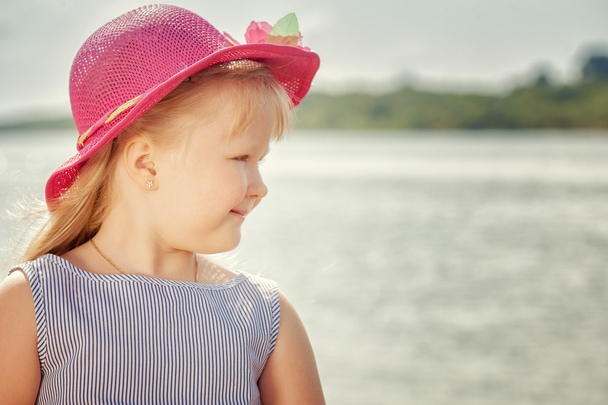 Portrait of beautiful little blond girl in hat - Fotografie, Obrázek