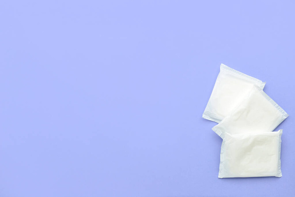 Menstrual pads on blue background - Фото, зображення