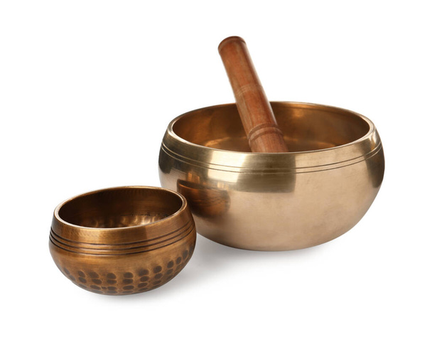 Tibetan singing bowls and wooden mallet on white background - Fotografie, Obrázek