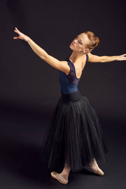 women ballerina in a black dress dance fashion exercise isolated background - Fotó, kép