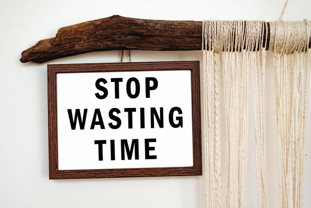 The words Stop Wasting Time written on a white paper. Motivation concept - Photo, Image