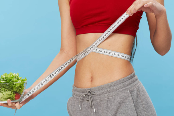 slim woman measuring tape health plate with salad - Φωτογραφία, εικόνα
